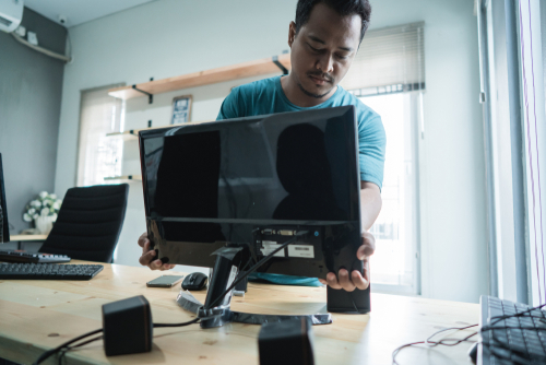 man setting up computer