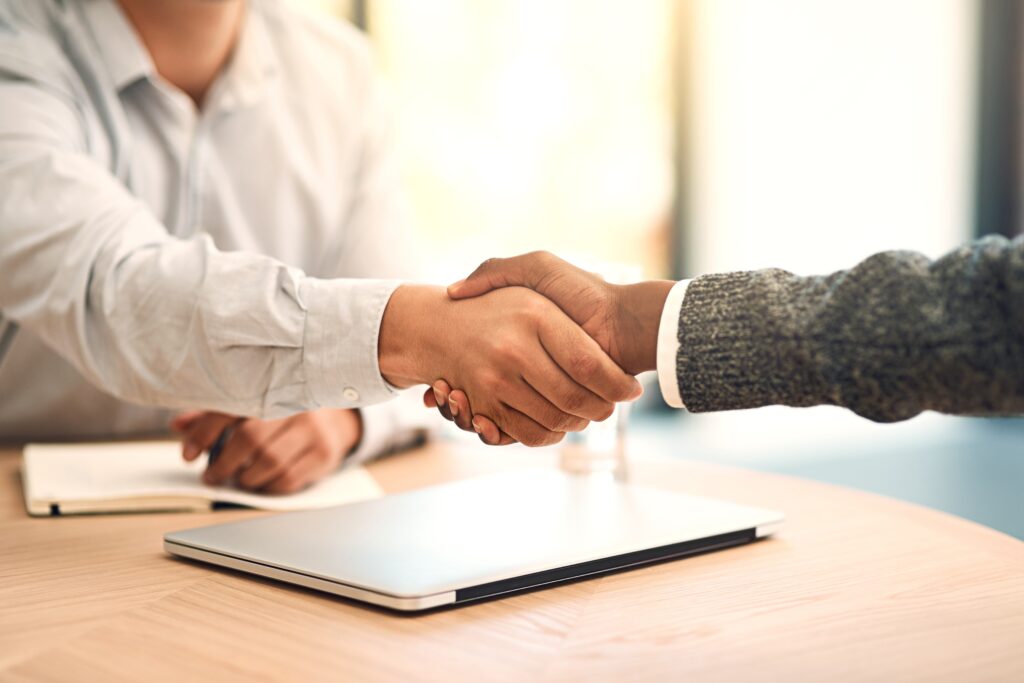 ShakingHandsAgreementAndPartnershipInOfficeWithBusinessPeople | LG Networks, Inc.